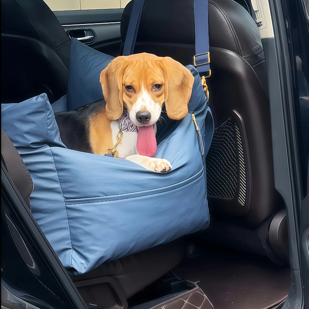 Beagle resting its front paws on the padded edge of the navy petsperro dog car seat on a car back seat