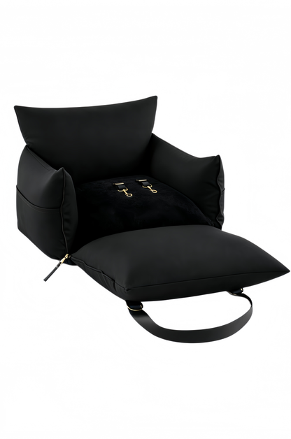 Black dog car seat bed opened flat, showing the plush base, bolsters and harness clips