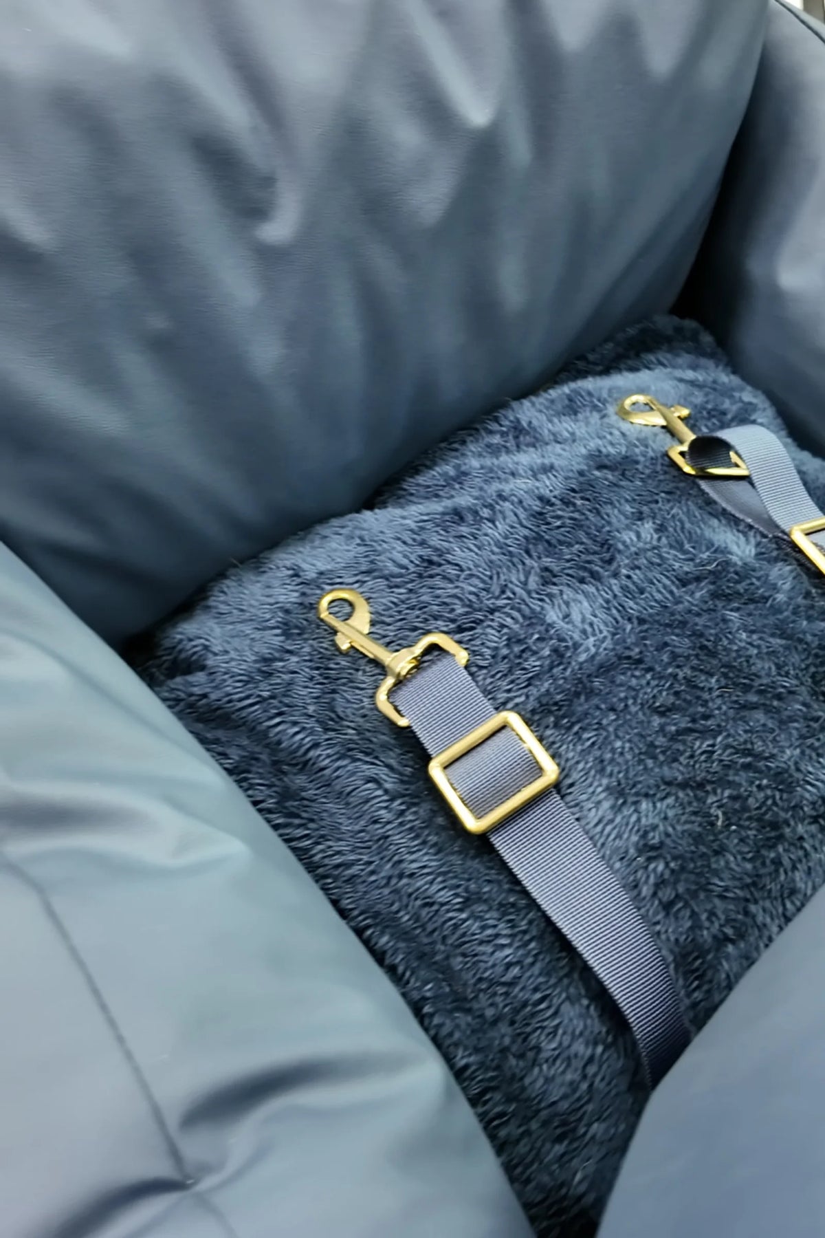 Inner safety clip on the plush base of the navy petsperro dog car seat, which attaches to your dog's harness
