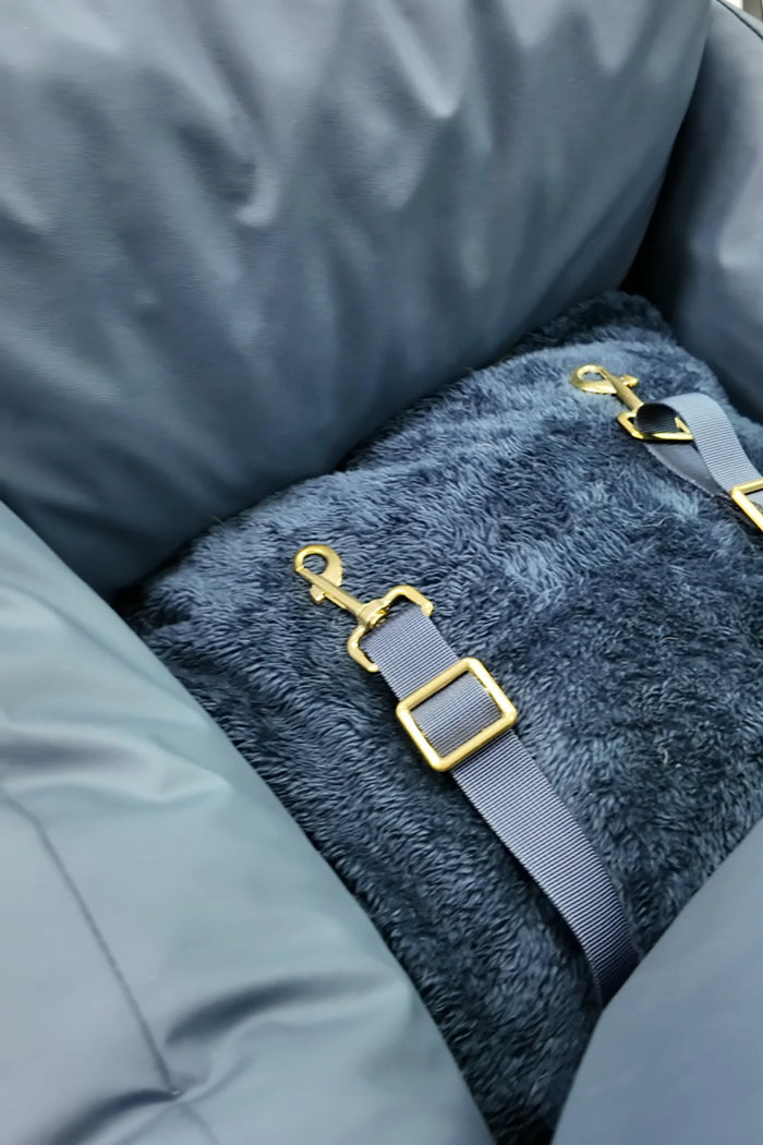 Inner safety clip on the plush base of the navy petsperro dog car seat, which attaches to your dog's harness