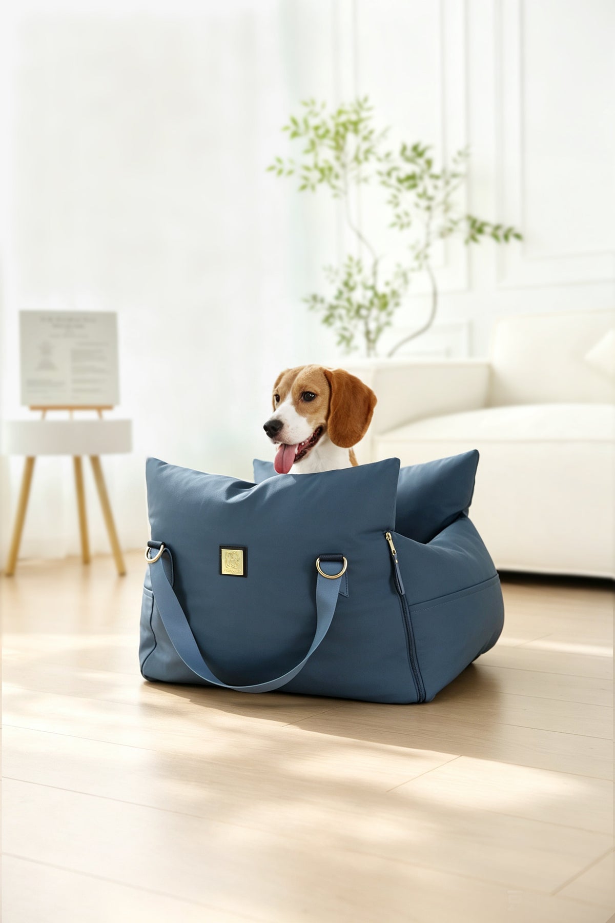 Beagle resting in the navy petsperro dog car seat bed on a living room floor at home