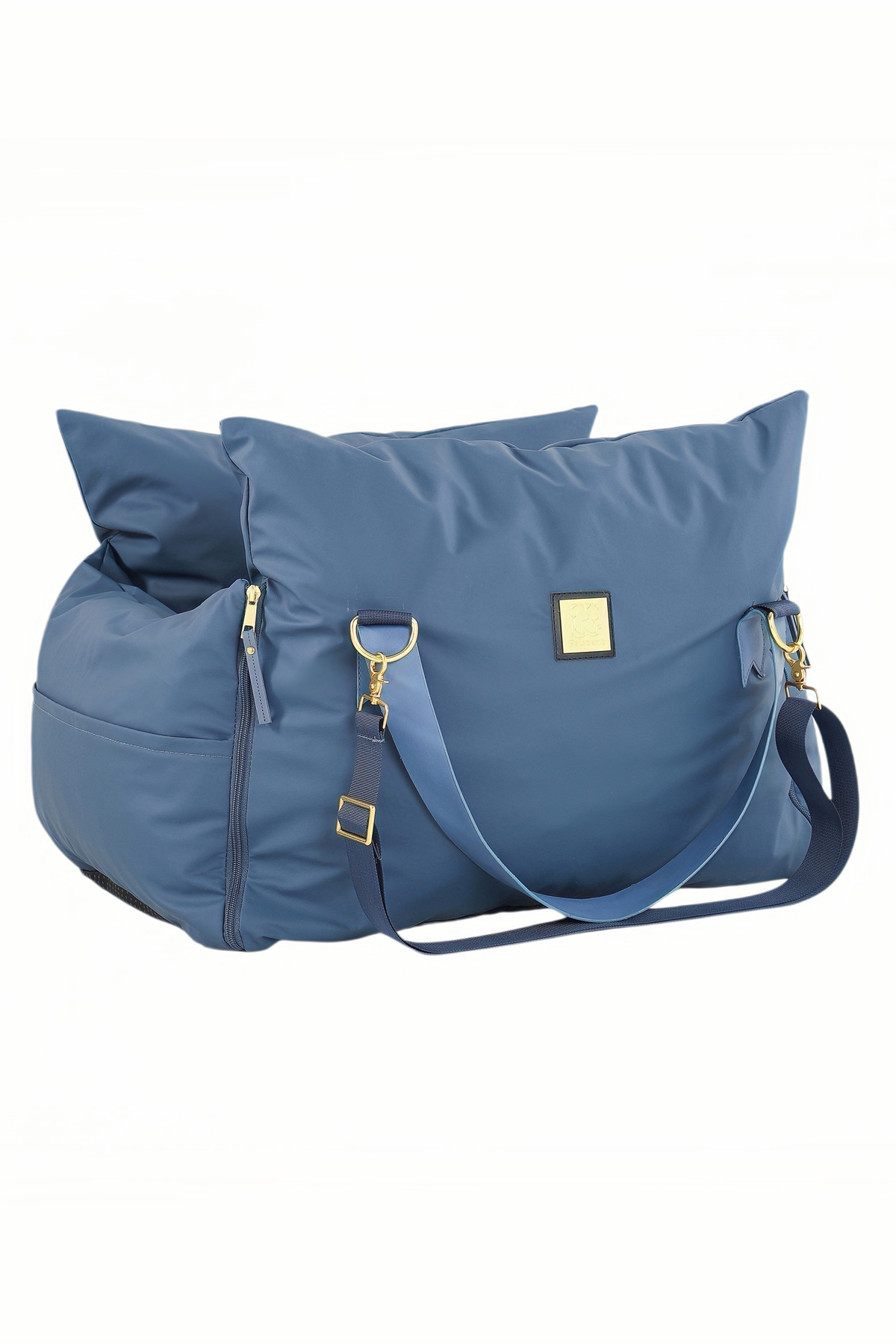 Navy petsperro dog car seat folded into carry-bag shape with shoulder strap and gold hardware
